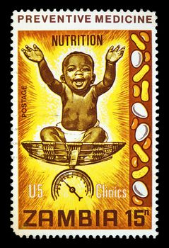 Vintage cancelled postage stamp with nutrition preventive medicine illustration. Zambia, Africa, circa 1970.