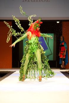 CANARY ISLANDS - 29 OCTOBER: Model on the catwalk wearing carnival costume from designer Agustin Munoz during Carnival Fashion Week October 29, 2011 in Canary Islands, Spain