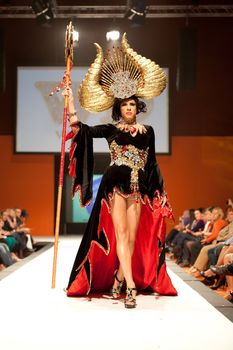 CANARY ISLANDS - 29 OCTOBER: Model on the catwalk wearing carnival costume from designer Willie Diaz during Carnival Fashion Week October 29, 2011 in Canary Islands, Spain