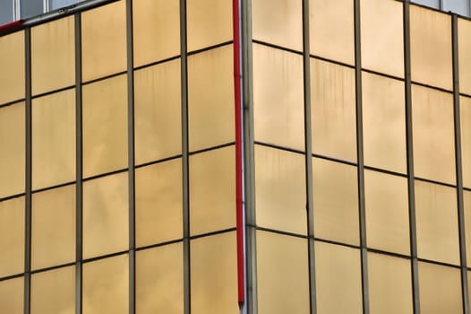 Glass windows facade of a modern office building. Architectural detail.
