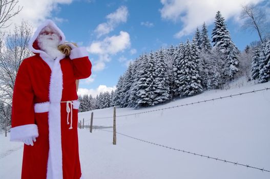 Santa Claus, Father Christmas in a beautiful winter landscape