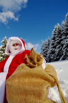 Santa Claus, Father Christmas in a beautiful winter landscape