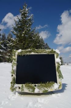 a decorated screen in snowy winter landscape
