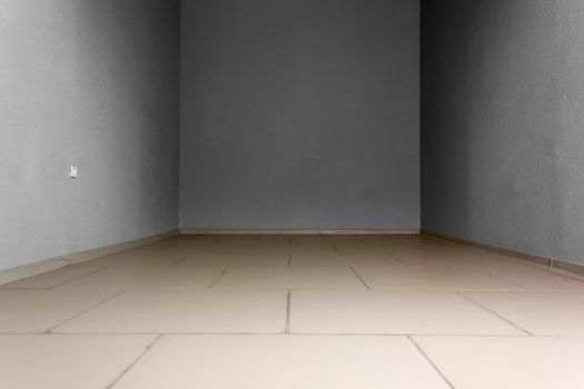 Empty room with electric socket and stone tiles at the floor. Background