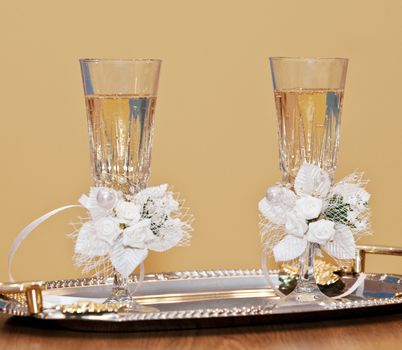 Wedding glasses. Glasses with a champagne decorated decorative flower
