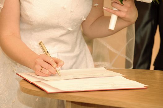 The wedding signature. Ceremony of wedding, a fastening the signature