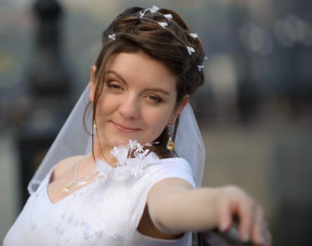 The bride. The young girl in a wedding dress on an abstract background
