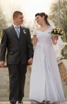 Newly-married couple. Pair young men in wedding day