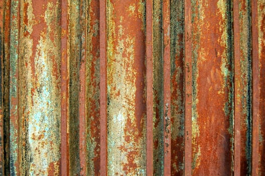 Paint peeling off rusty metal surface. Metal texture background.