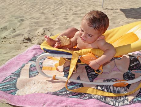 Little boy eating a biscuit