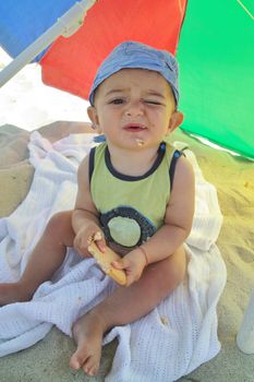 Little boy eating a biscuit