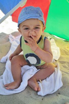 Little boy eating a biscuit