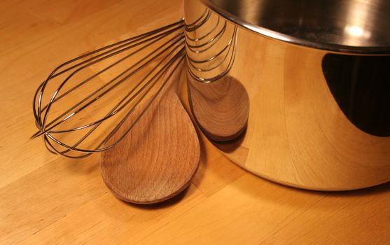Cooking Tools sitting on a wooden table.