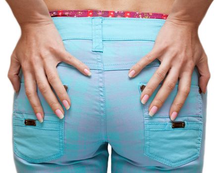 Feminine prist in blue jeans, hands with manicure on white background