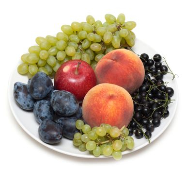 Still life, plate with fruit peaches grape discharges currant