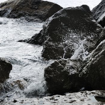 Splash of waves about coastal stones. Crimea, Ukraine