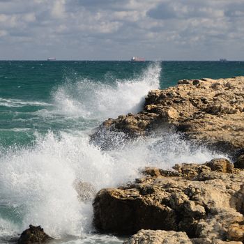 Splash of waves about coastal stones. Crimea, Ukraine