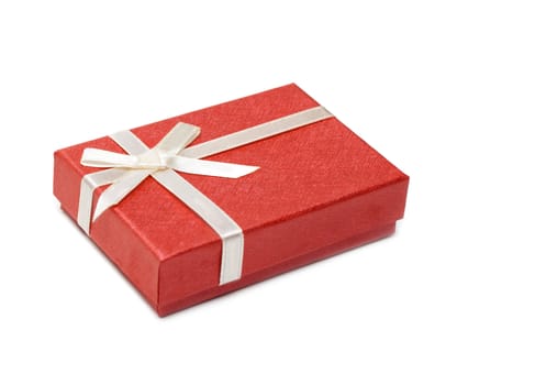 Red gift box, silvery bow isolated on white background
