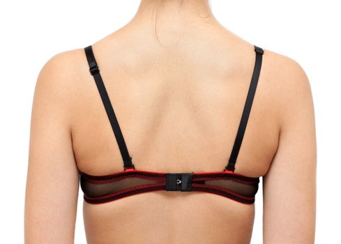 Back of the girl in bra isolated on white 
