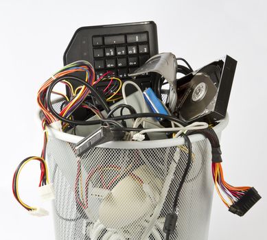 different computer parts in trash can