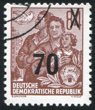 GERMANY - CIRCA 1953: stamp printed by Germany, shows Dove and East German family, circa 1953