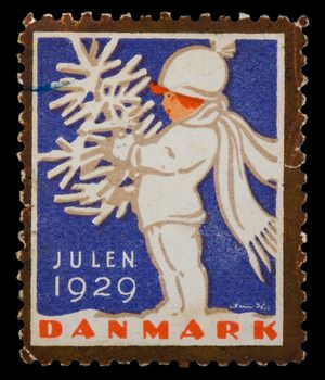 Vintage cancelled postage stamp with Christmas illustration. Denmark, 1929.
