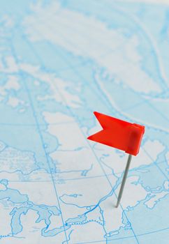 Flag a pin. A label on a planimetric map