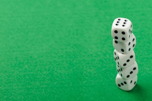 dices. Game cubes on a green background