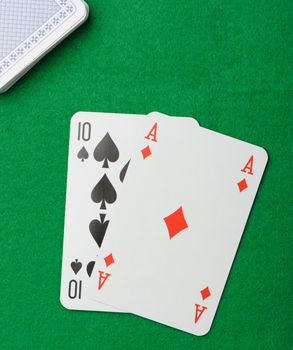 blackjack.Playing cards on a green background. Poker cards
