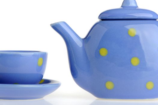 Color cup and teakettle. Tiny utensils it is isolated on a white background