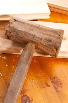 tools series: wooden hammer on table and plank