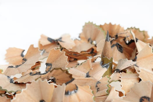 Pencil in an environment shavings. A photo close up