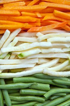 Background of julienne vegetables:  green beans, baby marrows and carrots