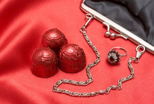 Beautiful black purse with silver chain handles, beautiful engagement ring and chocolate truffles - perfect Valentines day gift