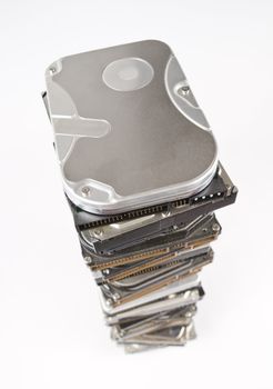 Stack of hard drives with copy space on top in light grey background