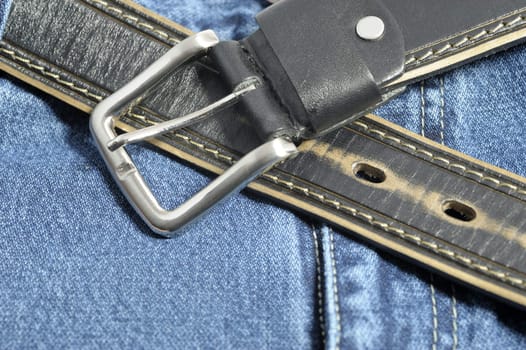 Jeans. A fragment trousers - jeans, with a leather belt