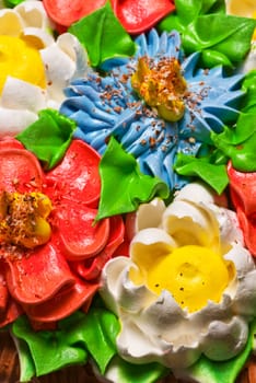 Celebratory cake. Ornate by colors from a cream.
