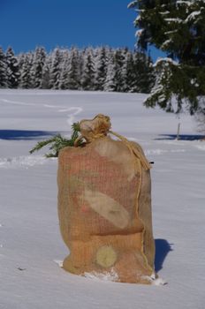 A bag from Santa Claus in a snowy landscape