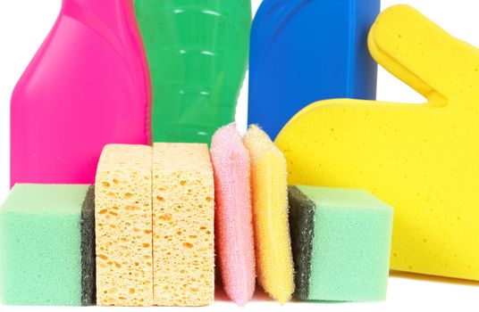 Variety of cleaning products such as sponges, gloves, and bottles with chemicals isolated on white background