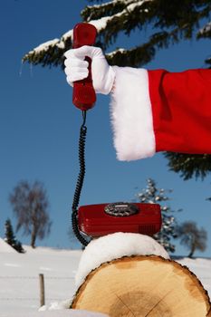 Santa Claus Hotline symbolized by a red retro phone