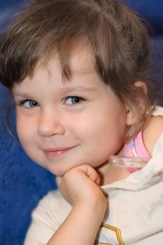 The girl with a thermometer. A portrait close up