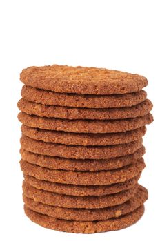 Big baked chocolate cookies stacked together isolated on white background