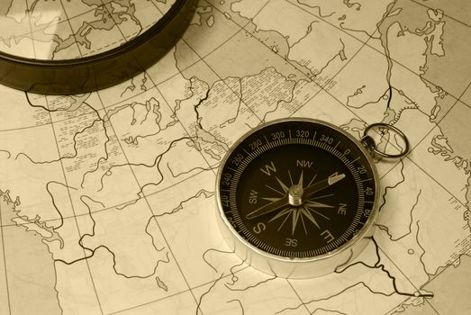 Ancient compass. The old device for the instruction of a direction and an old card