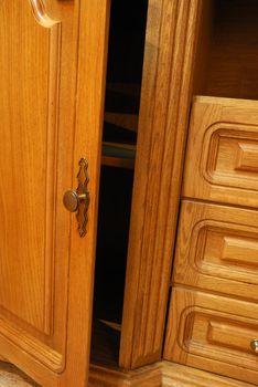 Boxes of a locker. A locker from a tree, with carved incrustation and iron handles