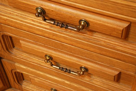 Boxes of a locker. A locker from a tree, with carved incrustation and iron handles
