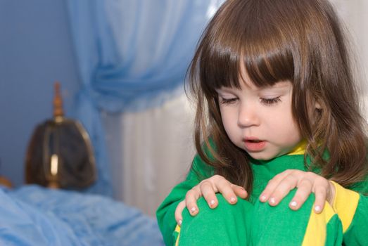 sorrow little girl. The three-year child of the European nationality