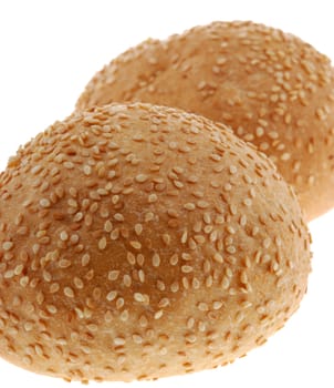 bun for sandwich. A bakery product strewed by grains