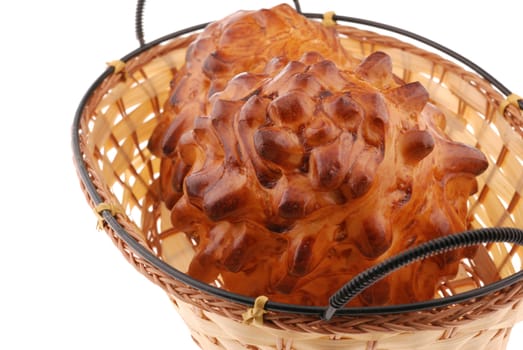 bun in basket. A sweet bun it is isolated on a white background
