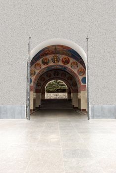 Arch gateway in church. The paved way to a white building