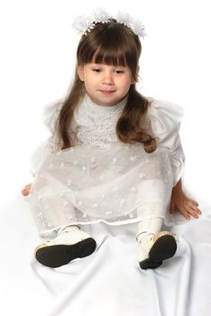 The girl in a white dress. It is isolated on a white background. Age 3 years